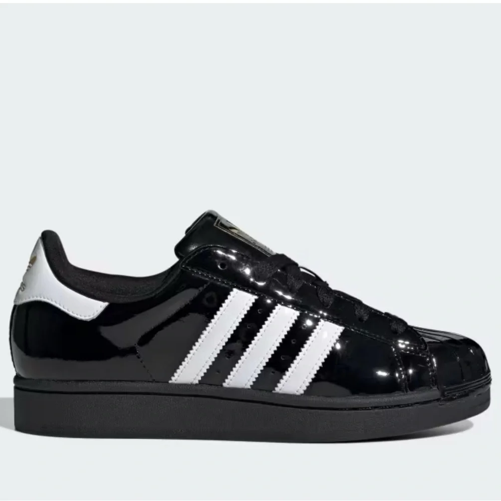 Adidas Glossy Black Sneakers with White Stripes - Picture 1 of 1